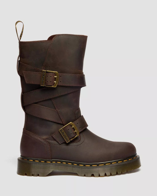 Brown leather boot with buckles on a light gray background
