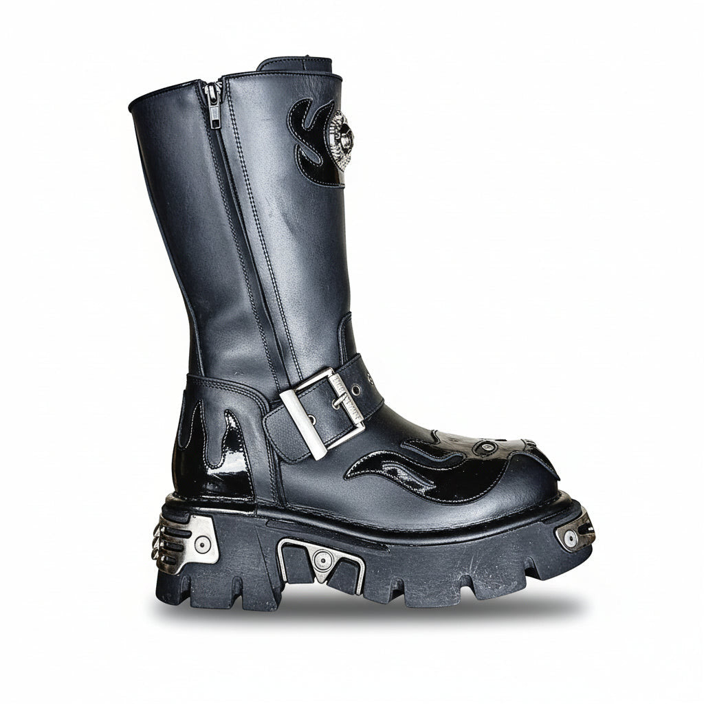 A black leather boot with skull flame accents and a tower design, featuring a lace-up closure and a chunky heel.