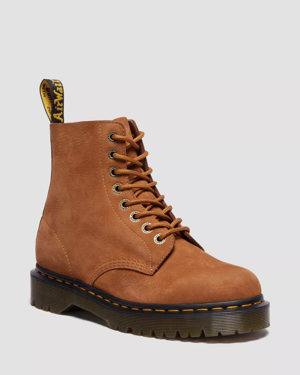 Brown leather boot with laces on a light gray background