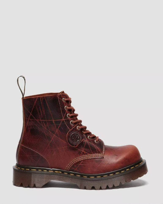Brown leather boot with lace-up design on a light gray background