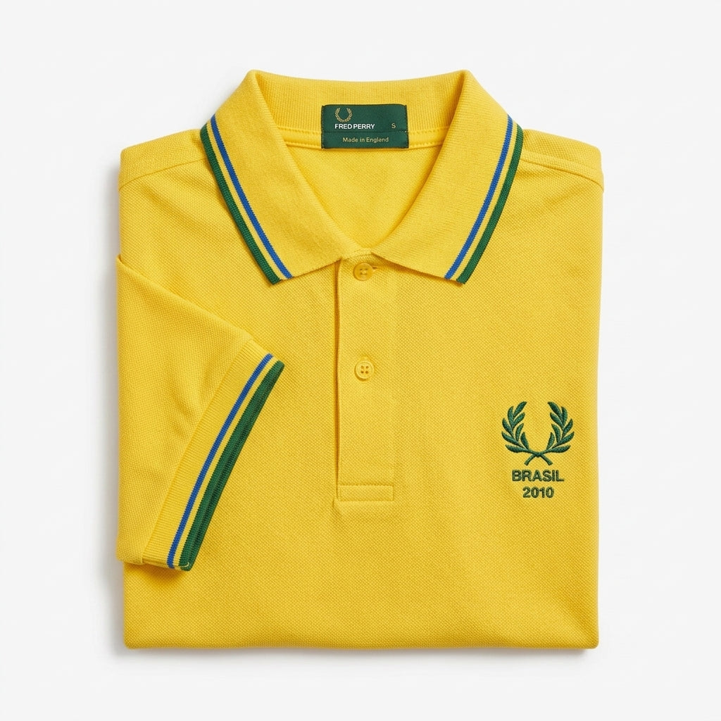 Fred Perry vintage world cup Brasil 2010 twin-tipped yellow polo shirt with green and blue accents on collar and sleeves laurel wreath logo Brasil 2010