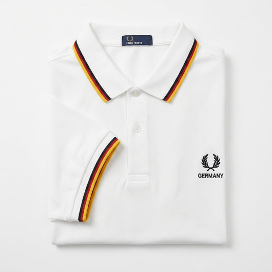 Fred Perry vintage world cup twin-tipped white polo shirt with red black and gold trim and Fred Perry logo on a white background