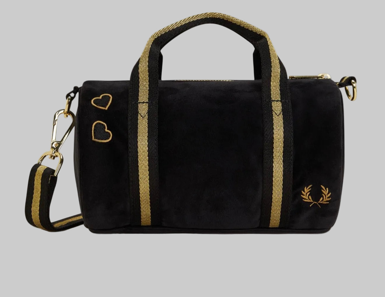Black duffel bag with gold accents on a white background