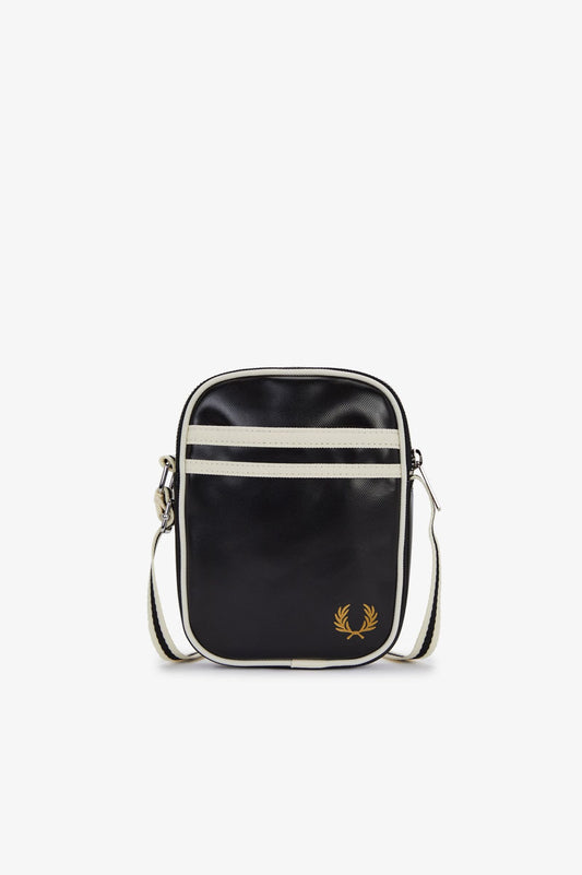 Black crossbody bag with white strap on a white background