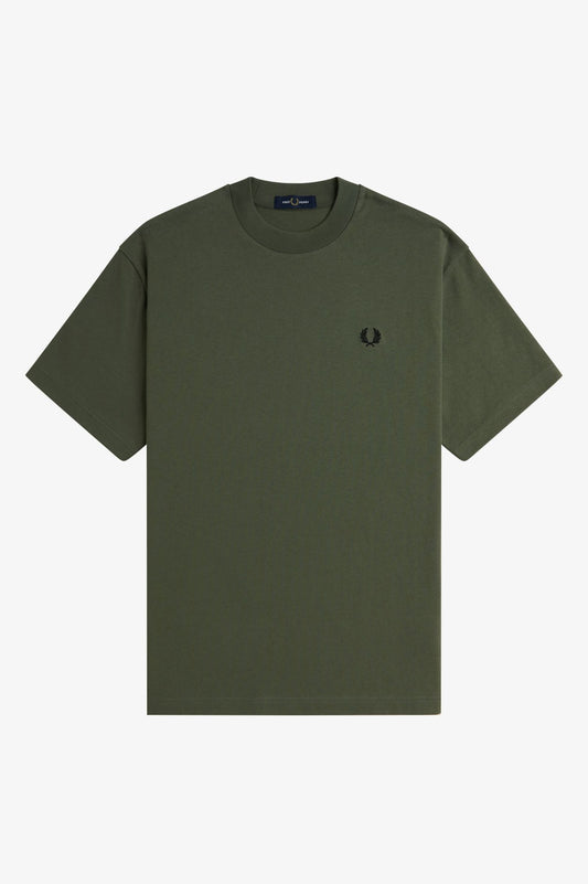 Green t-shirt with a small logo on a light gray background
