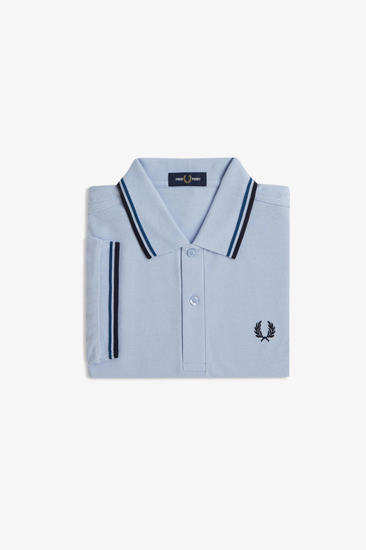Light blue polo shirt with black accents on a white background