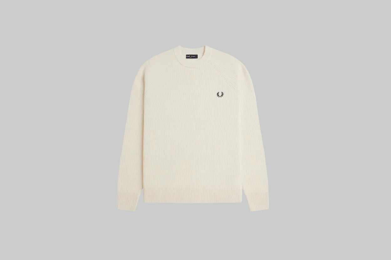 Cream-colored sweater with a brand logo on a white background