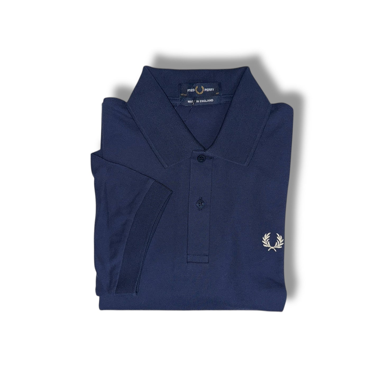 A navy blue Fred Perry polo shirt with a collar, button-up neck, and the brand's logo on the chest.