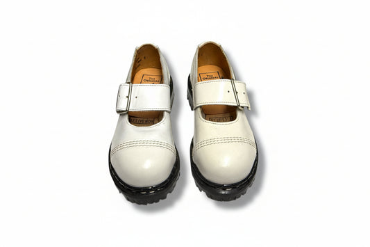 White shoes with black soles on a white background