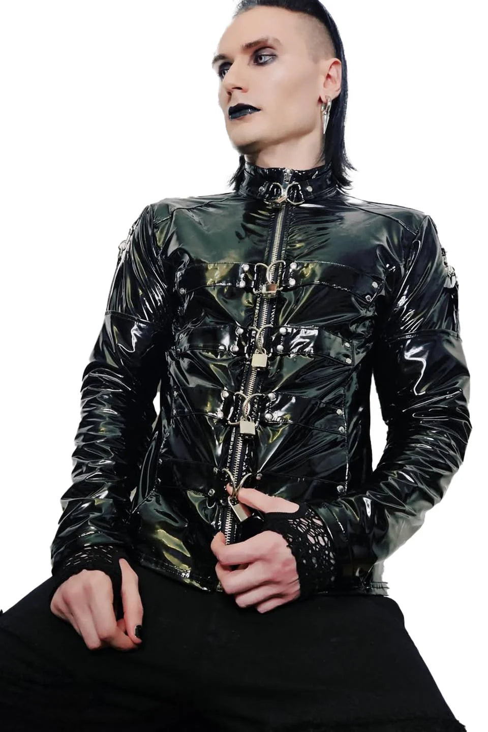 Person wearing a lip service shiny black jacket with intricate designs on a white background