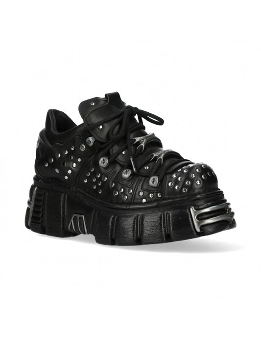 Black studded sneaker on a white background