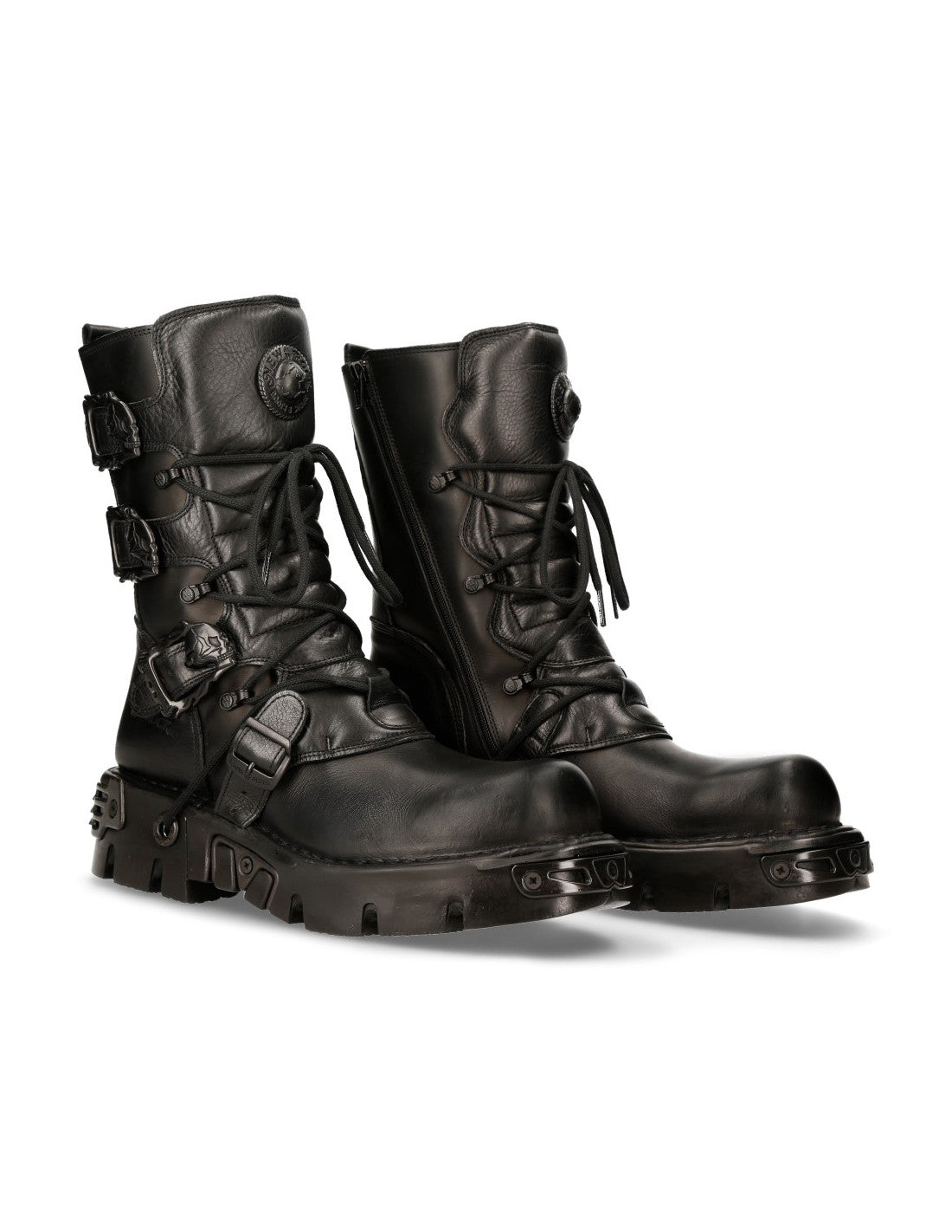 Pair of black leather boots with buckles on a white background