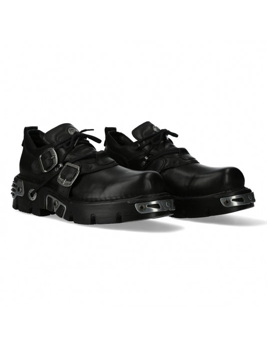 Pair of black leather shoes with buckles on a white background