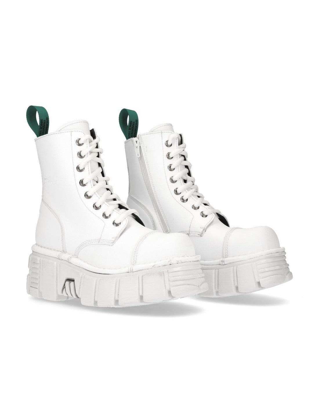 White combat boots with green accents on a white background