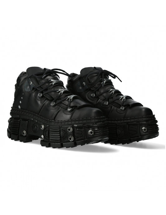 Pair of black high-top sneakers on a white background