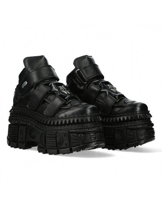 Black high-top sneakers with thick soles on a white background