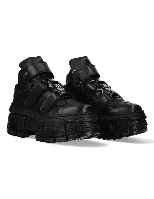 Pair of black high-top sneakers with thick soles on a white background