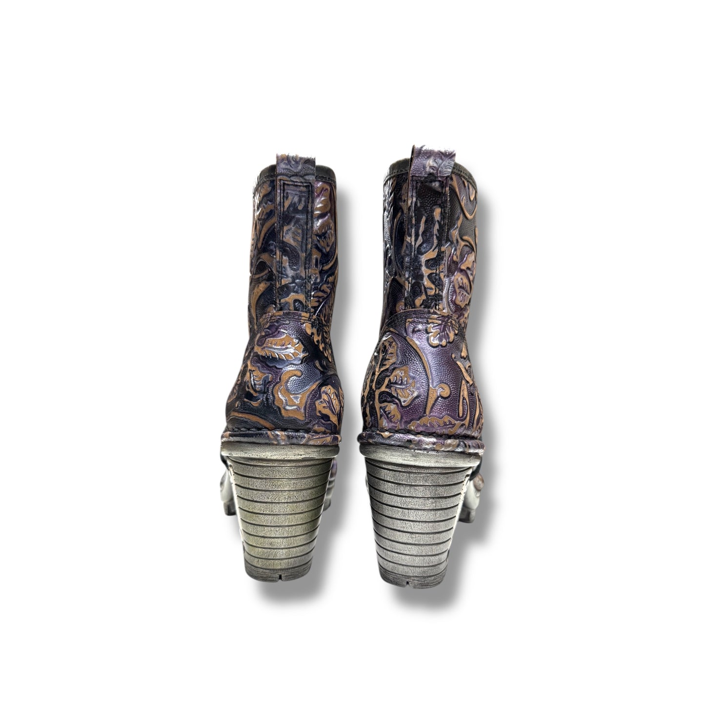 Pair of cowboy boots with detailed design on a white background
