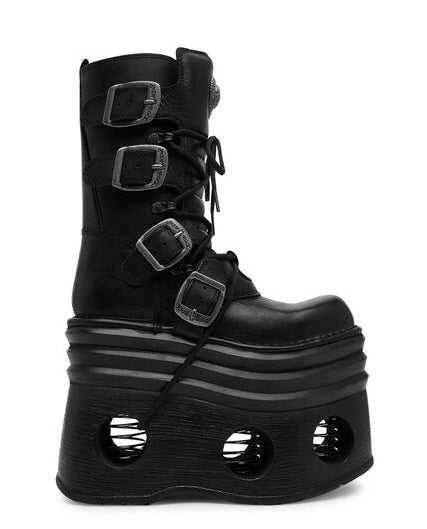 Black platform boot with buckles on a white background
