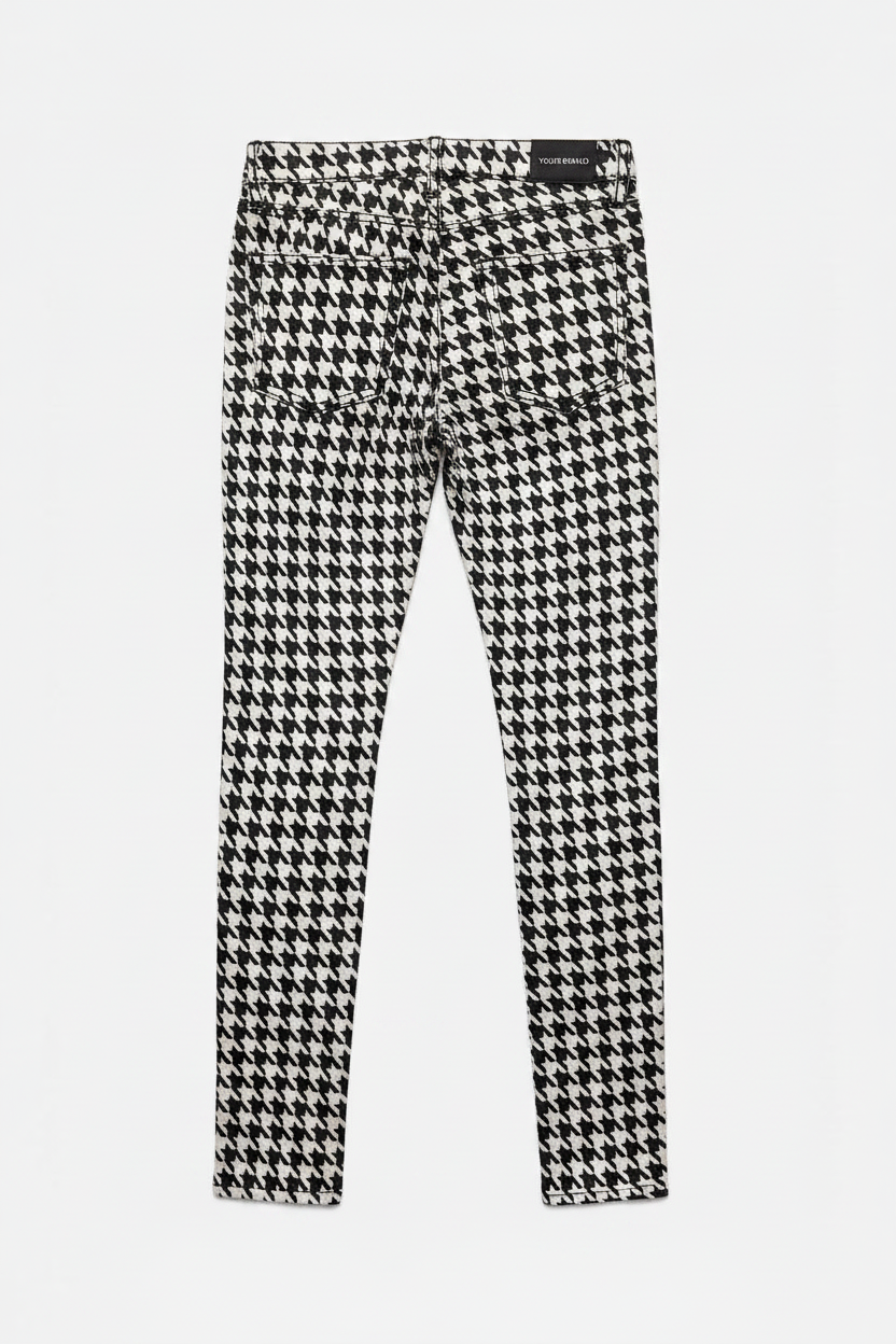 Houndstooth patterned pants on a white background