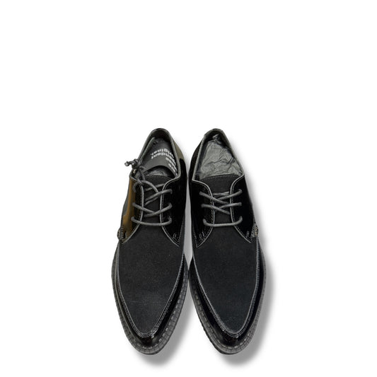 Black leather shoes on a white background