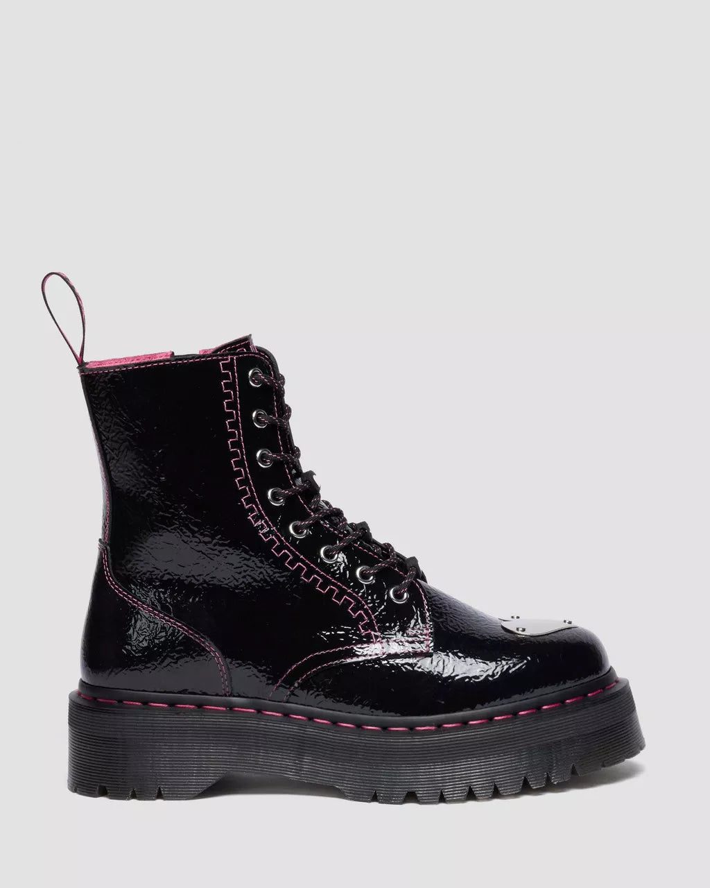 Black patent leather boot with pink trim on a light gray background