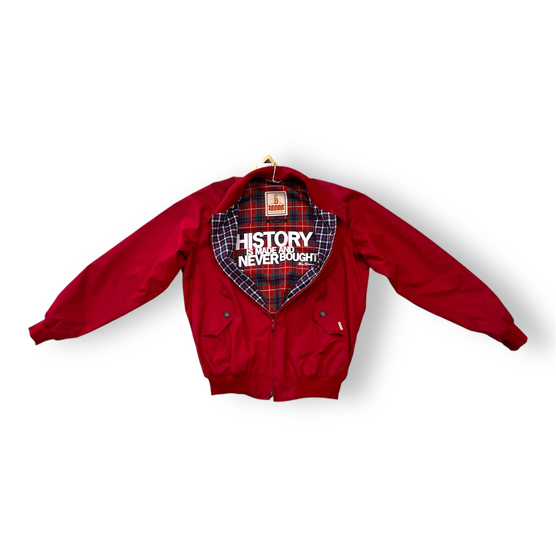 A red and black checkered Ben Sherman Baracuta Harrington jacket with a 'HISTORY NEVER RUSTS' text on the back.