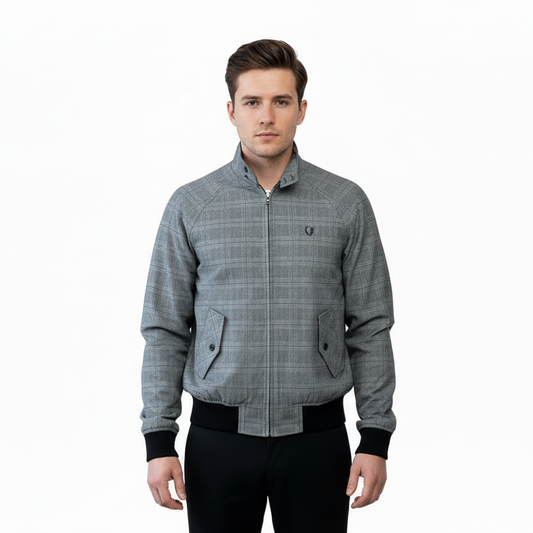 Man wearing a gray checkered bomber jacket on a white background