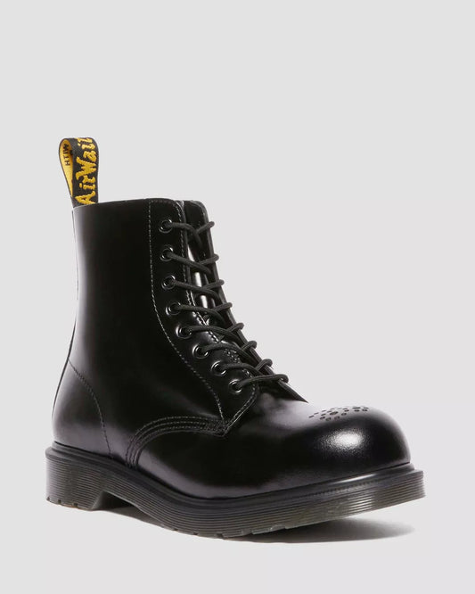 A black Dr. Martens lace-up boot with a steel toe cap.
