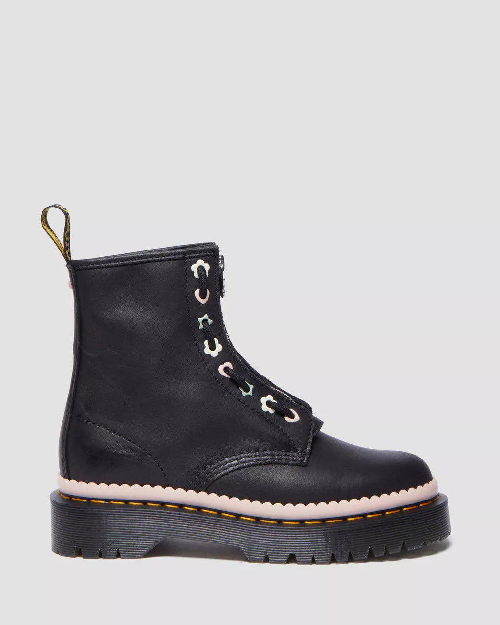 A black Dr. Martens leather boot with a front zipper, lace-up closure, and a thick sole.