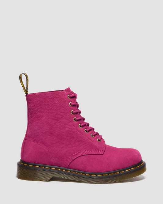 Pink boot with brown sole on a light gray background