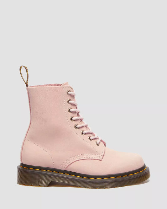 A pair of pink nubuck leather Dr. Martens 1460 Pascal boots with lace-up closure.