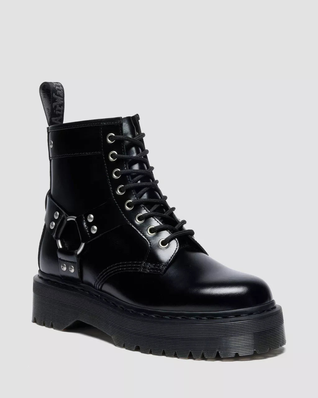 Black leather boot with unique design elements on a light gray background