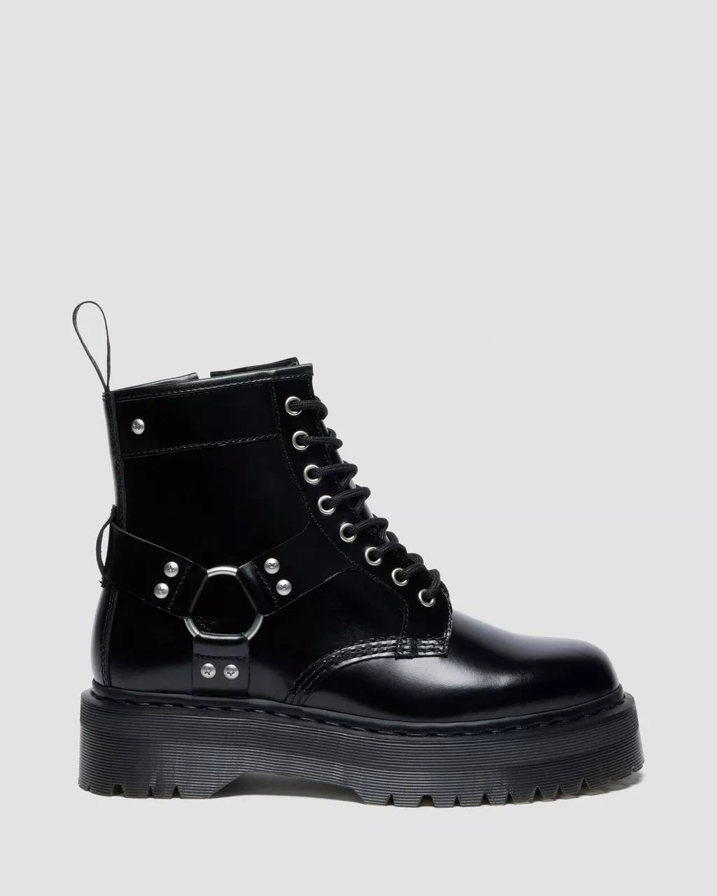 Black leather boot with metallic accents on a light gray background