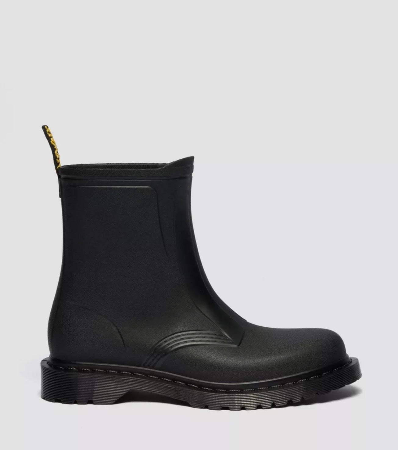 Black rubber boot on a light gray background