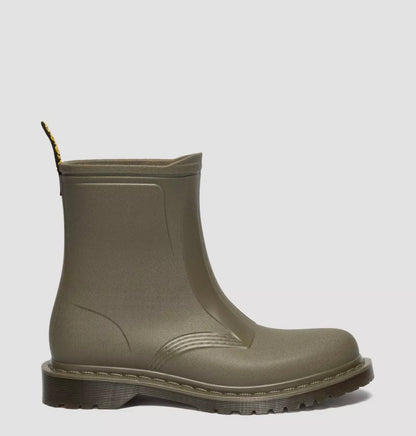 Green rubber boot on a light gray background