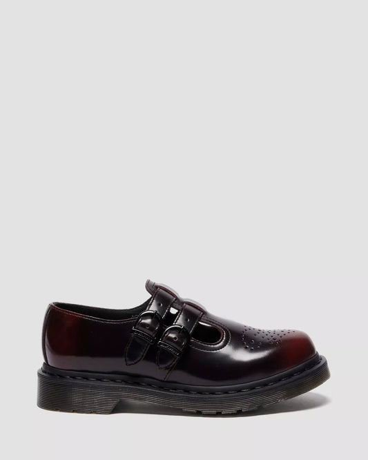 Black leather shoe with a glossy finish on a white background