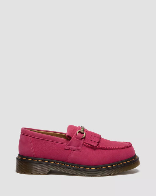 Pink loafer shoe on a light gray background
