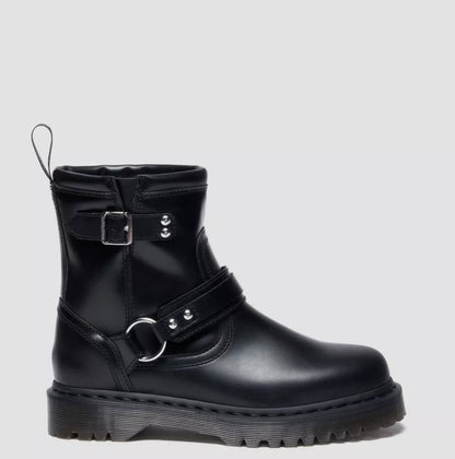 Black leather boot with buckles on a light gray background