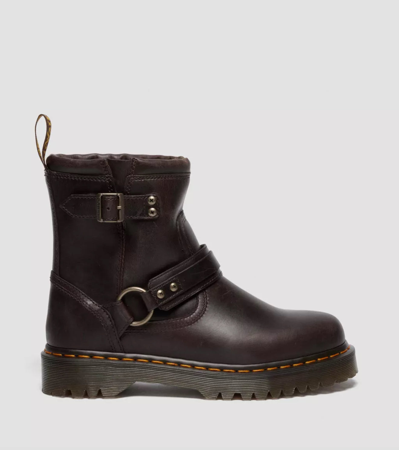 Brown leather boot with buckles on a light gray background