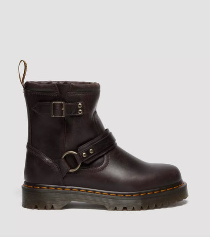 Brown leather boot with buckles on a light gray background