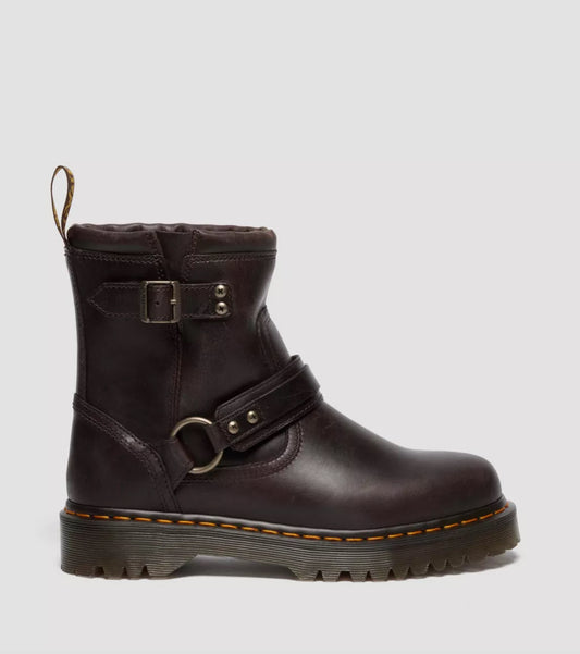 Brown leather boot with buckles on a light gray background