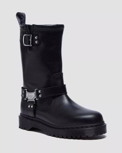 Black leather boot with buckles on a light gray background