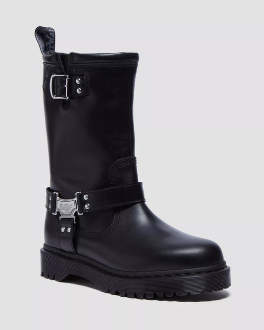 Black leather boot with buckles on a light gray background