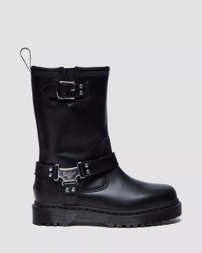 Black boot with metal buckles on a light gray background