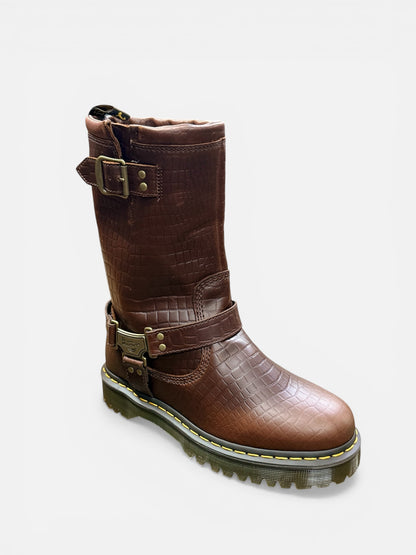 Brown leather boot with buckles on a white background