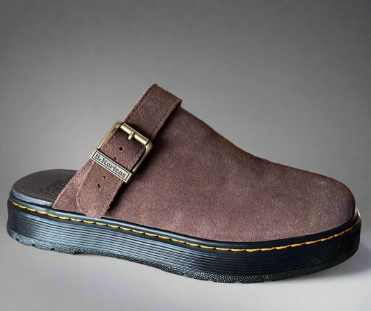 Brown Dr. Martens sandal with a strap on a gray background