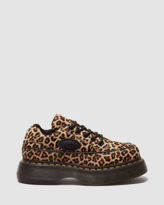 Leopard print sneaker with black sole on a light gray background