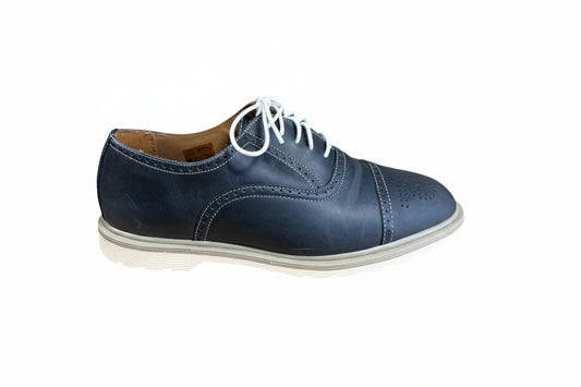 Blue leather shoe with white laces on a white background