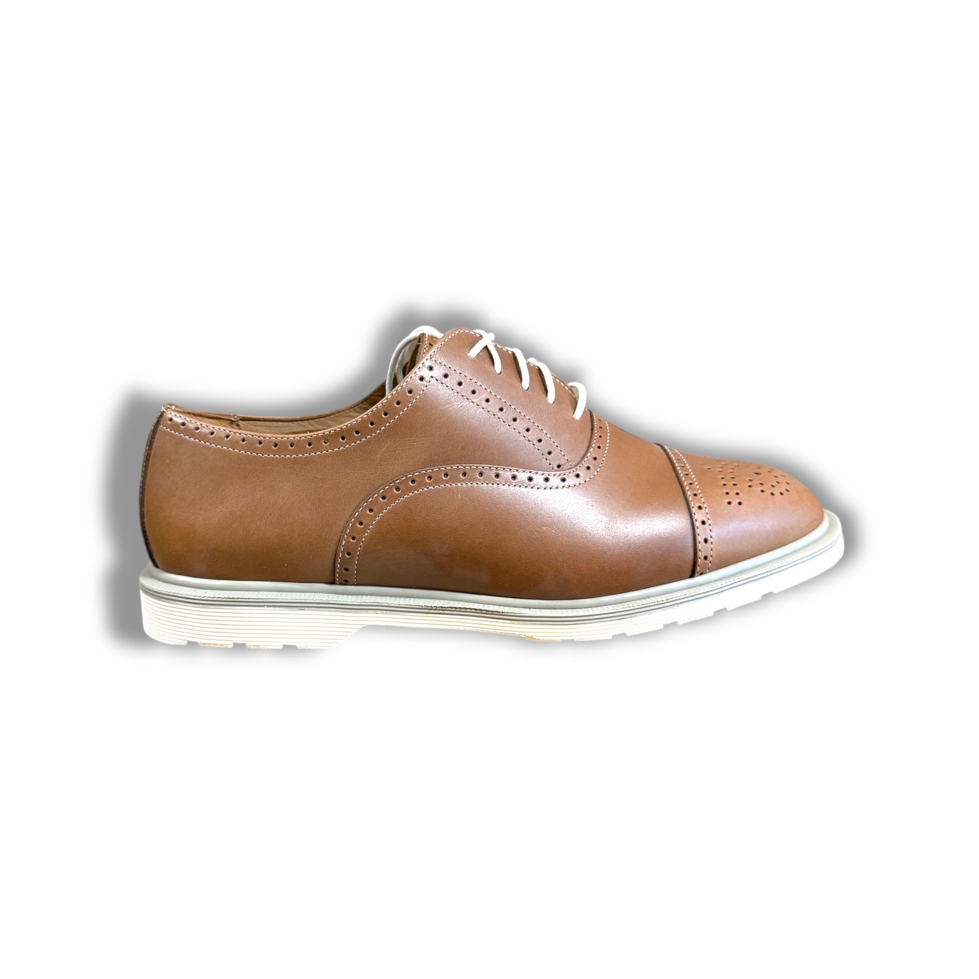 Brown leather shoe with white sole on a white background